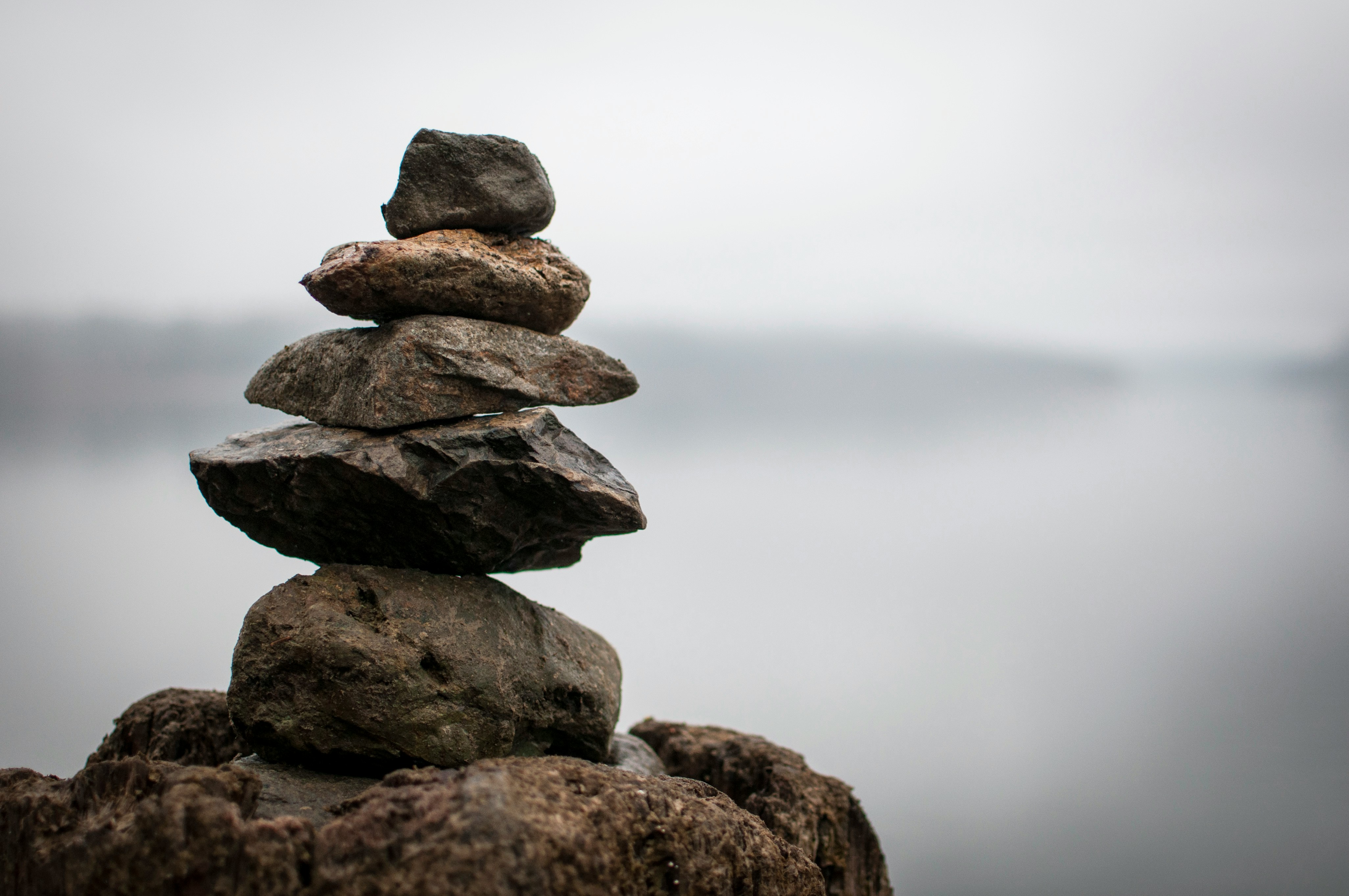 Stone cairn representing balance and grounding in EMDR trauma therapy